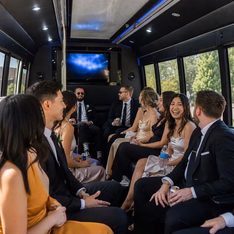 Wedding guests seated inside a Omaha party bus