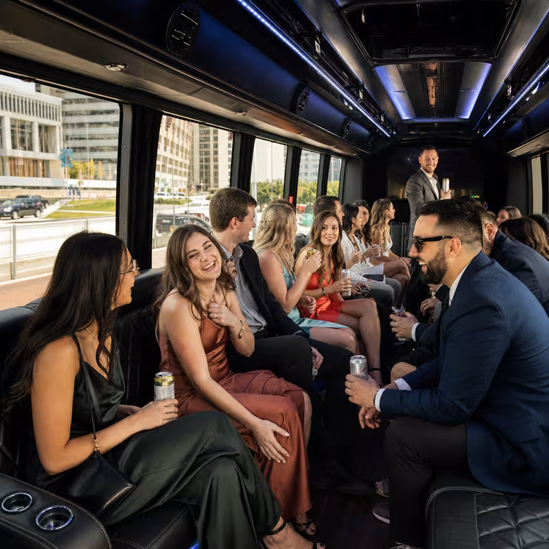 Party bus interior with wraparound leather seating and LED lighting in Omaha