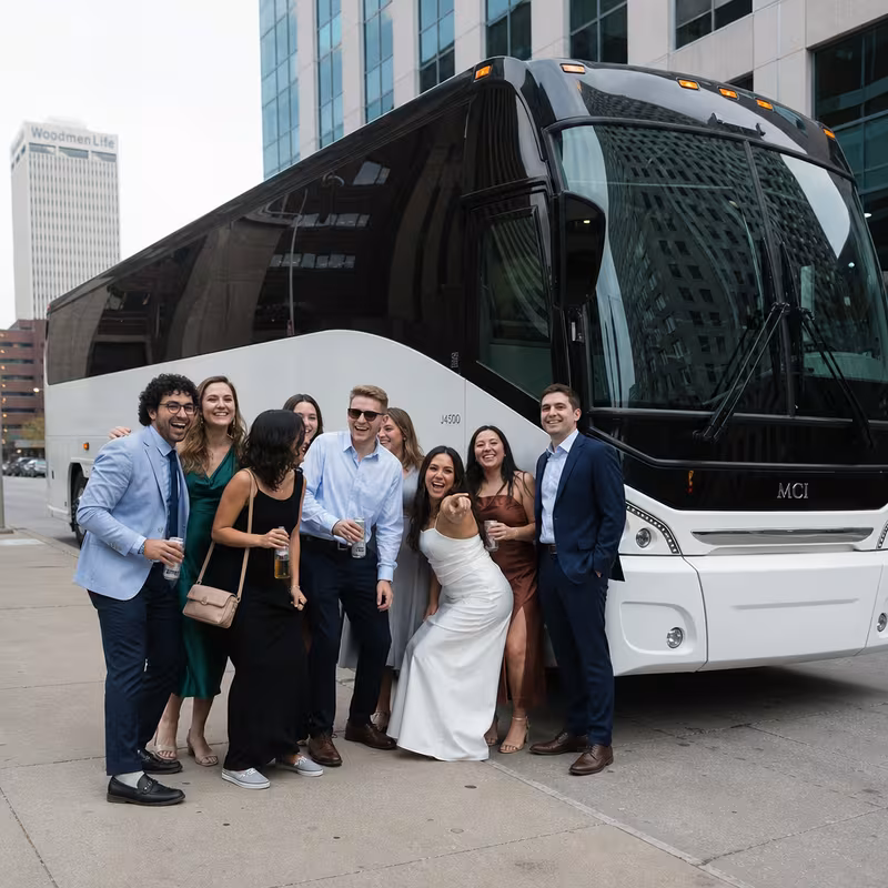 Passengers loading luggage while boarding an Omaha group shuttle