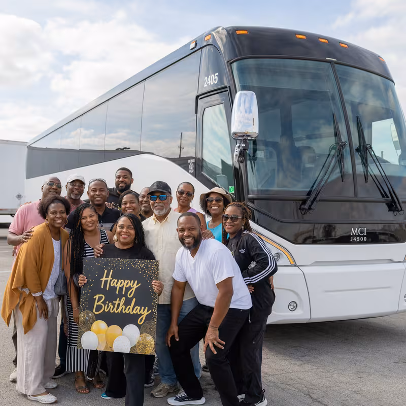Passengers loading luggage while boarding an Omaha group shuttle