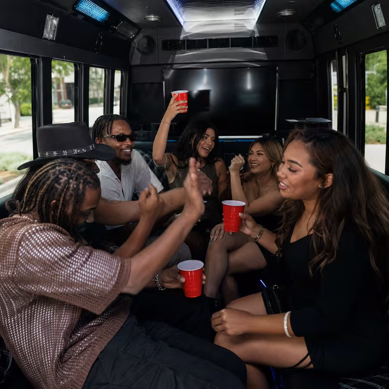 Passengers loading luggage while boarding an Omaha group shuttle