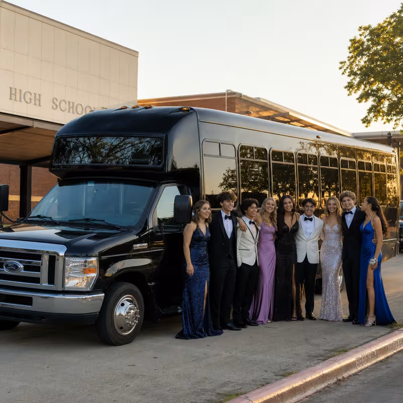Group boarding a white charter bus for Prom & Homecoming Transportation transportation in Omaha