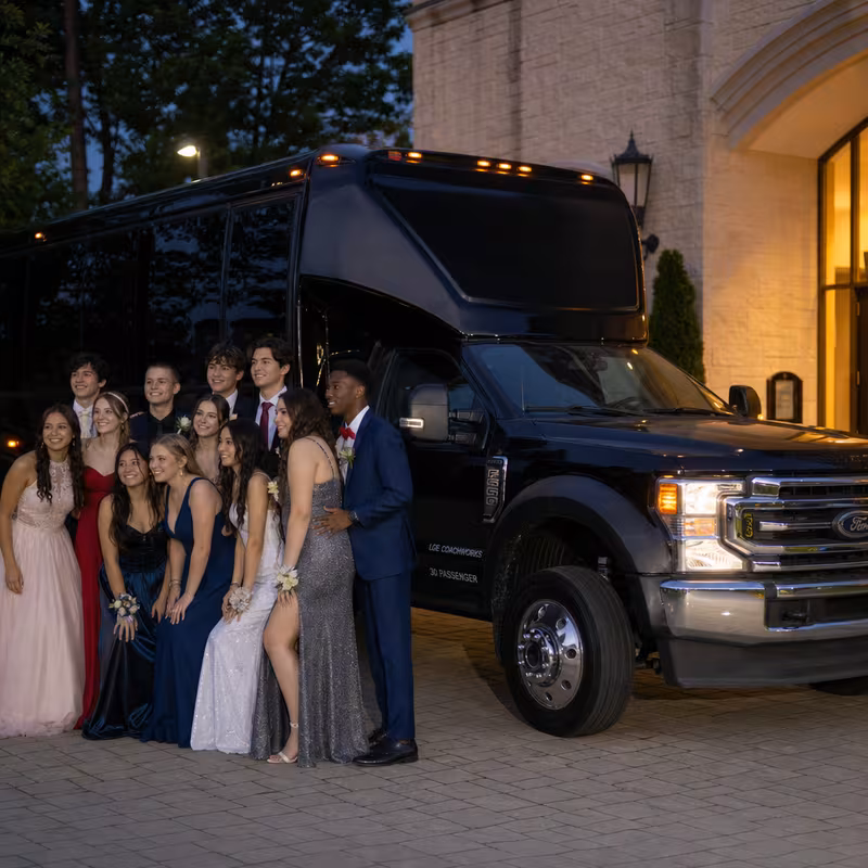 Party bus interior with wraparound leather seating and LED lighting in Omaha