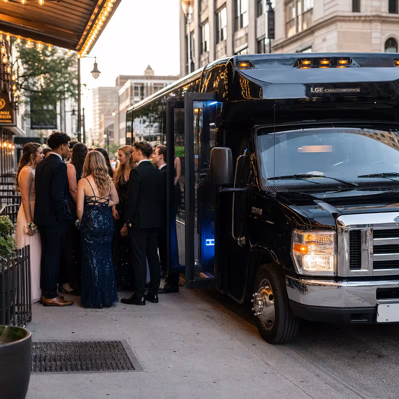Passengers loading luggage while boarding an Omaha group shuttle