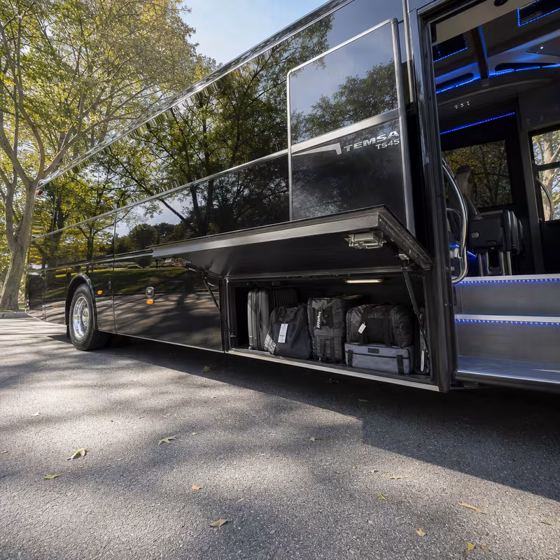 Party bus interior with wraparound leather seating and LED lighting in Omaha