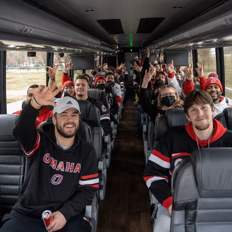 Black Mercedes Sprinter van staged for an Omaha Sporting Event Transportation group