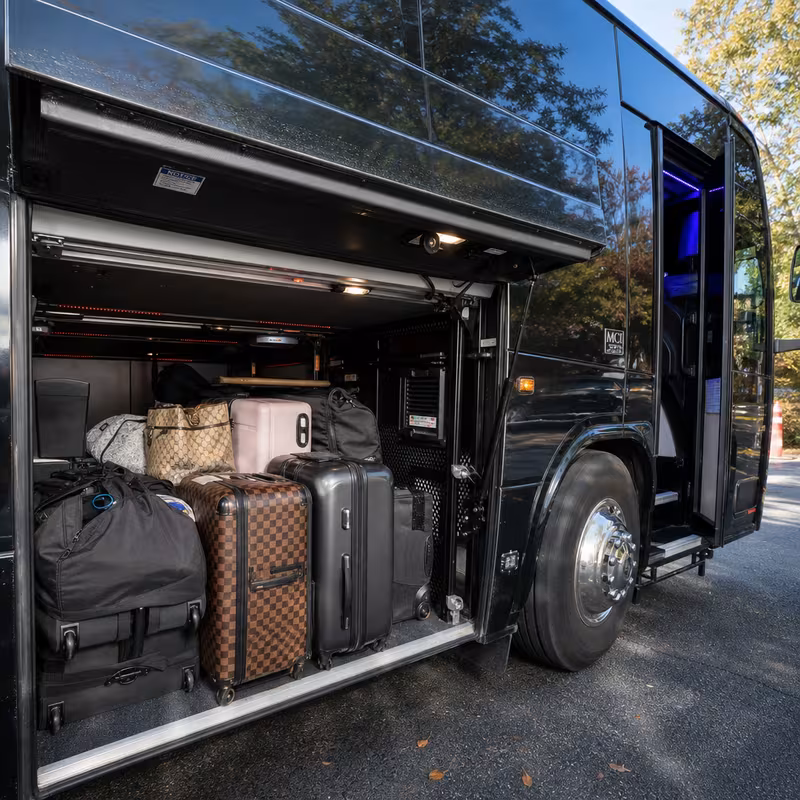 Party bus interior with wraparound leather seating and LED lighting in Omaha