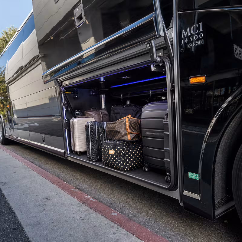Party bus interior with wraparound leather seating and LED lighting in Omaha