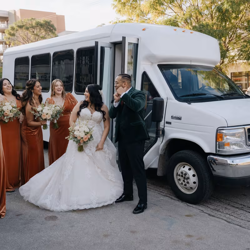 Passengers loading luggage while boarding an Omaha group shuttle
